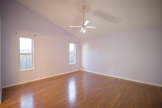 unfurnished room with dark wood-type flooring, ceiling fan, and high vaulted ceiling