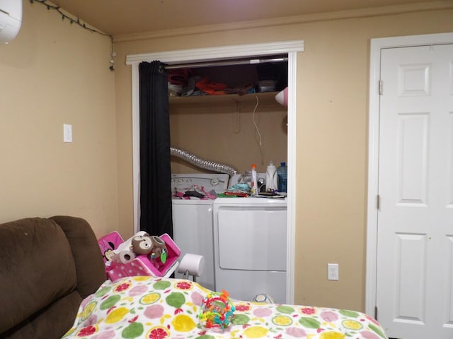 bedroom with a closet and washing machine and clothes dryer