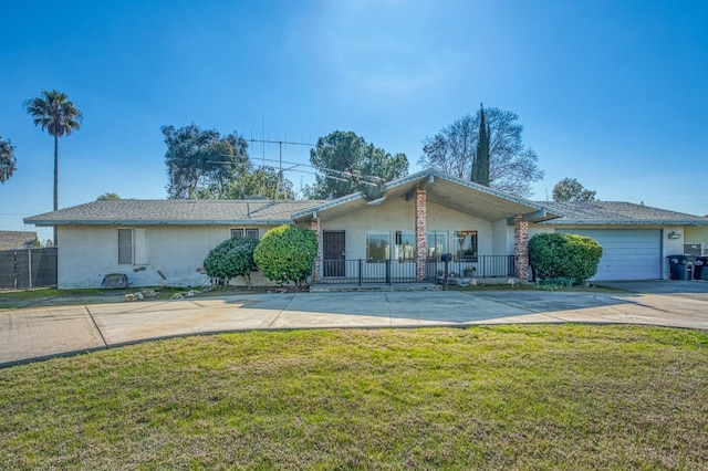 single story home featuring a garage and a front yard