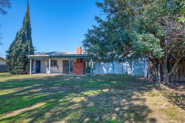 ranch-style home featuring a front yard