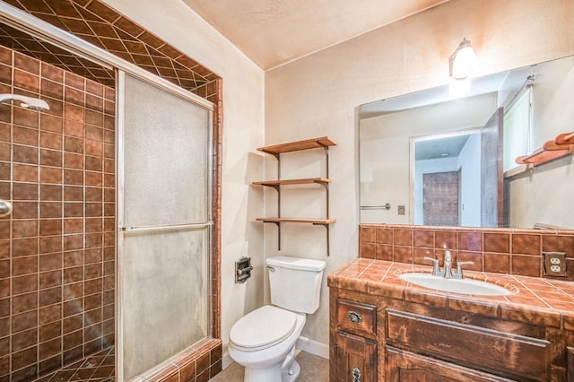 bathroom featuring backsplash, tile patterned flooring, vanity, walk in shower, and toilet