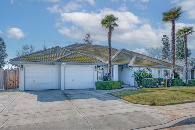 single story home with a garage and a front yard