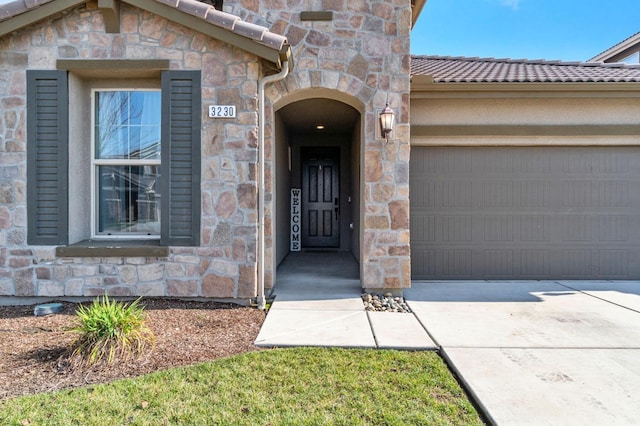 entrance to property featuring a garage