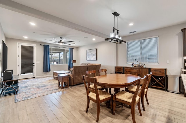 dining space featuring light hardwood / wood-style flooring and ceiling fan