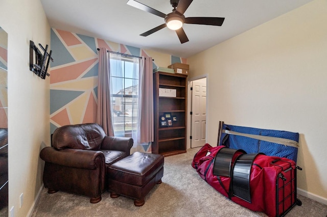 living area featuring ceiling fan and carpet floors