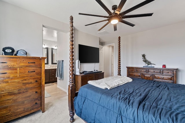 carpeted bedroom with connected bathroom and ceiling fan