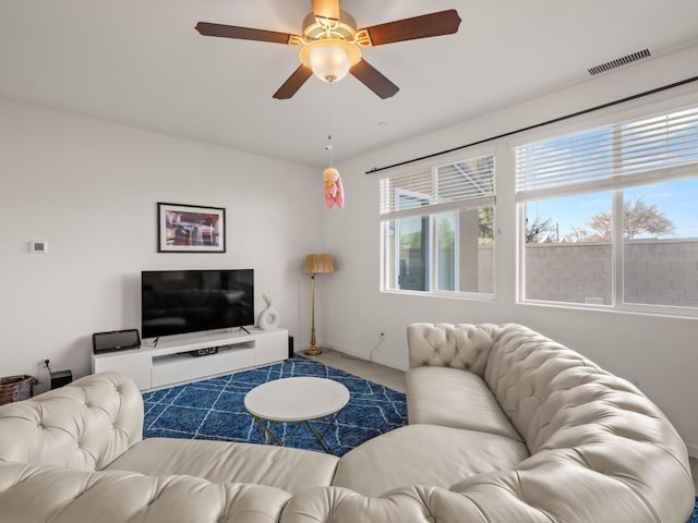 living room with carpet floors and ceiling fan