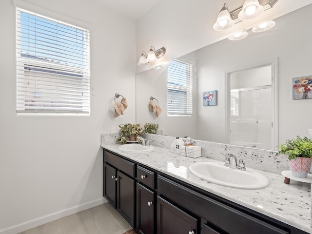 bathroom with vanity and a shower with shower door