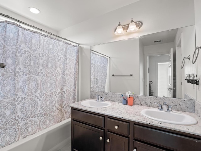 bathroom with shower / bath combination with curtain and vanity