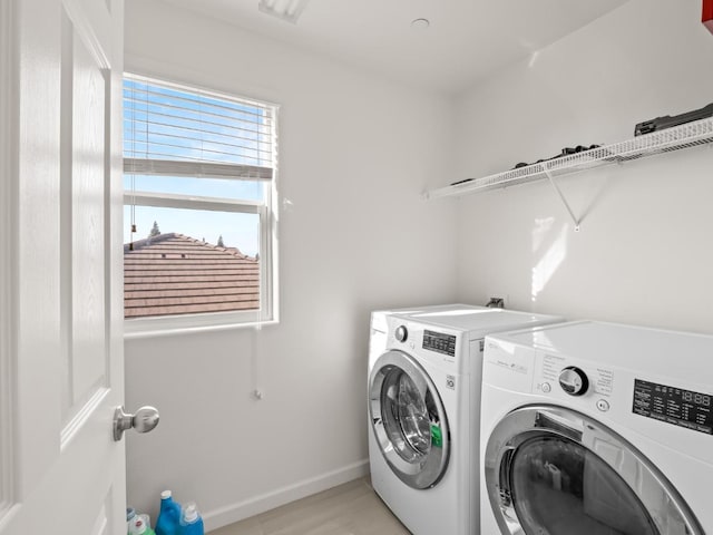 laundry room with independent washer and dryer