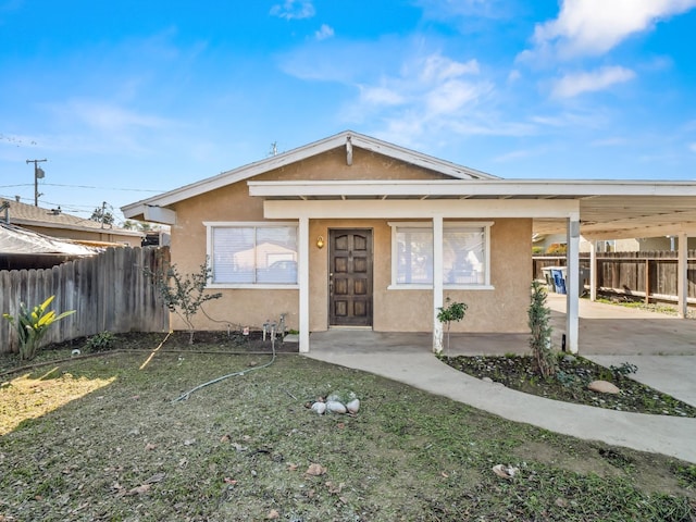 view of front of home featuring a carport