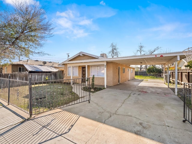 view of front of property featuring a carport