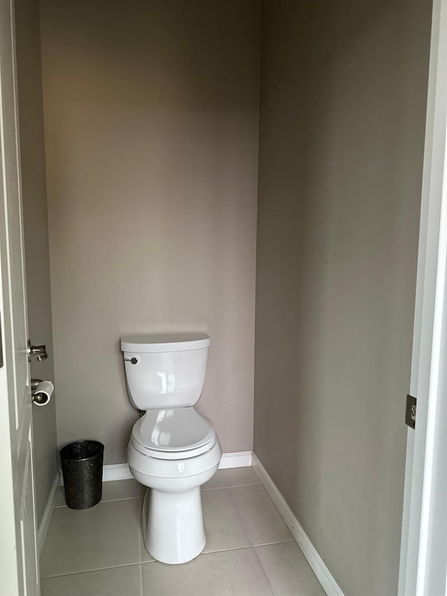 bathroom featuring tile patterned flooring and toilet