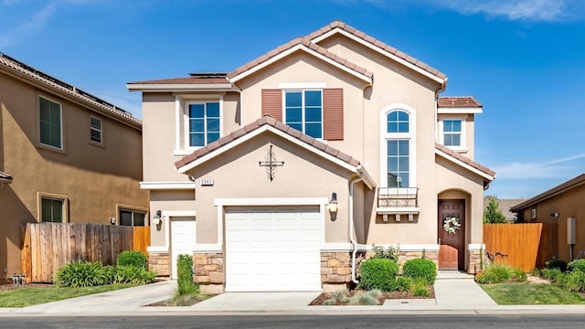 view of front of home with a garage and solar panels