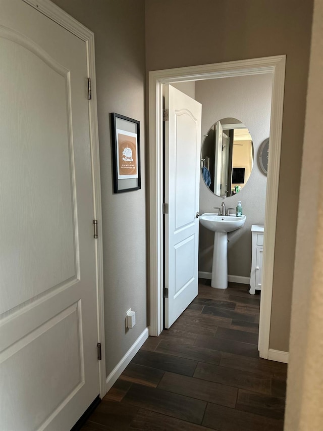 corridor with dark wood-type flooring