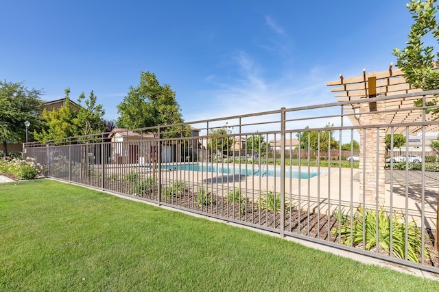 view of pool featuring a yard