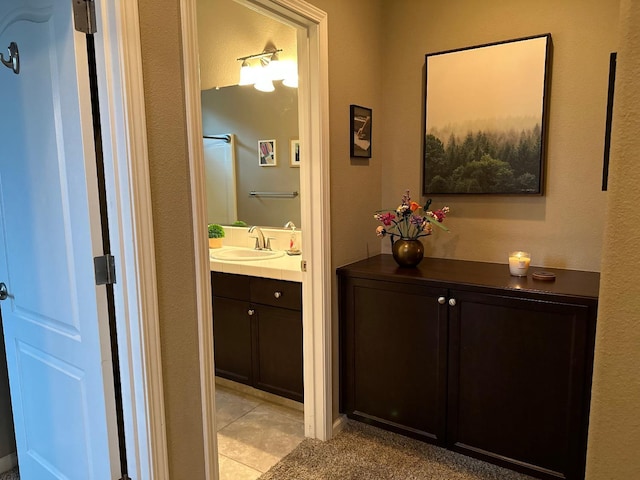 bathroom with tile patterned floors and vanity