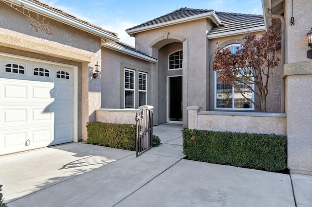 doorway to property featuring a garage