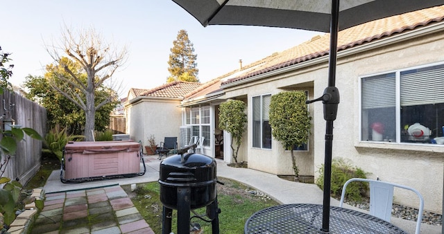 view of patio with a hot tub