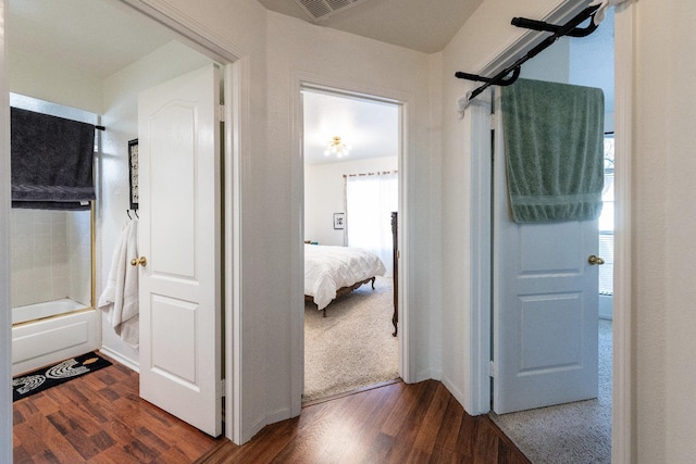 corridor with dark wood-type flooring