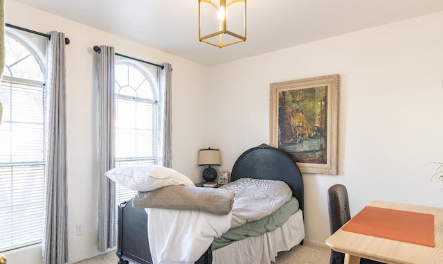 bedroom with multiple windows and carpet floors