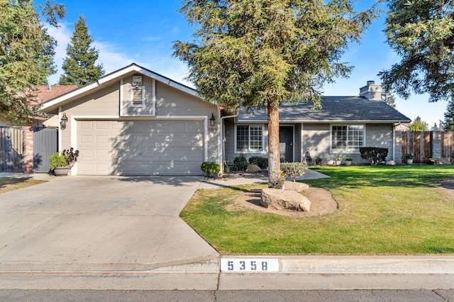 ranch-style home with a garage and a front yard