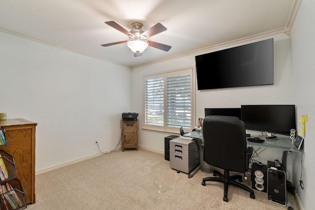 carpeted home office with ceiling fan, ornamental molding, and baseboards