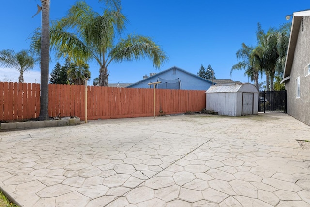 view of patio with a shed