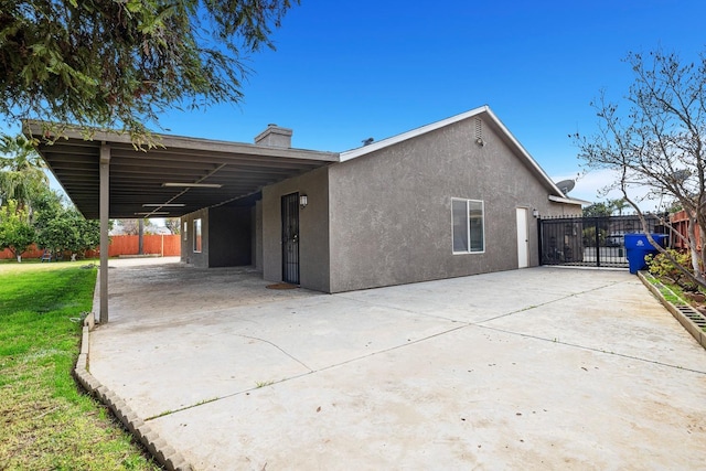 view of side of property featuring a carport