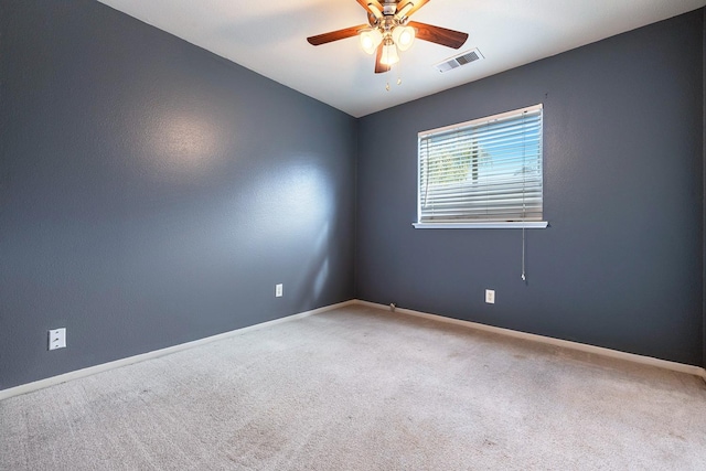 carpeted empty room featuring ceiling fan