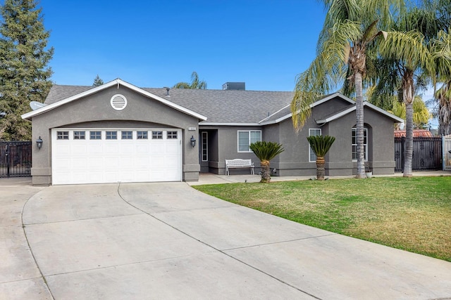 ranch-style home featuring a garage and a front lawn