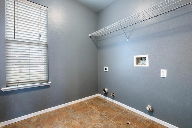 clothes washing area featuring gas dryer hookup, electric dryer hookup, and washer hookup