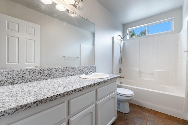 full bathroom featuring shower / bath combination, vanity, and toilet