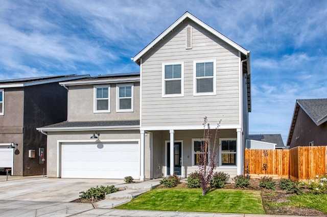 front facade featuring a garage and a front yard