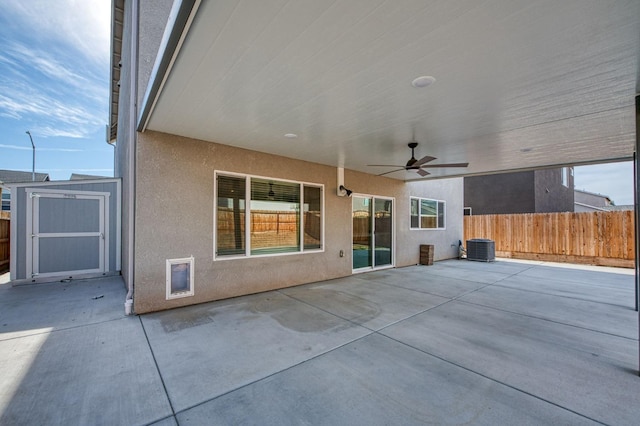 view of patio / terrace featuring a storage shed and ceiling fan