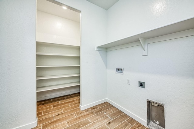 laundry room featuring electric dryer hookup and washer hookup