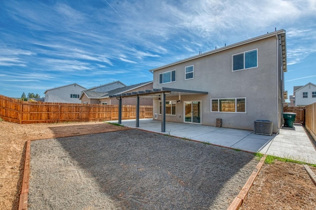 back of house with a patio area and central air condition unit