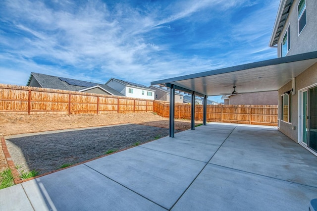 view of patio featuring ceiling fan