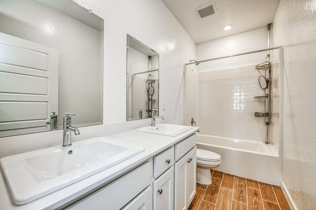 full bathroom with shower / bathtub combination, vanity, and toilet