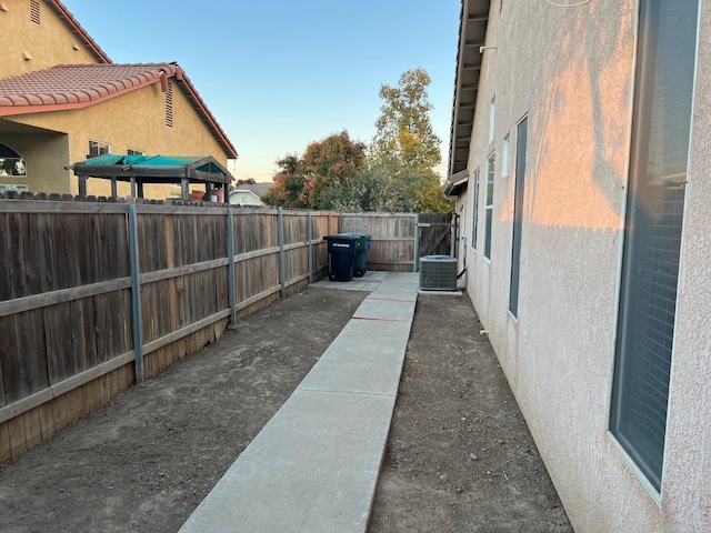 view of yard featuring central air condition unit