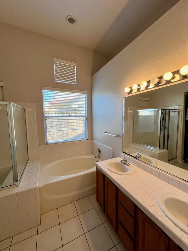 bathroom with vanity, shower with separate bathtub, and tile patterned flooring