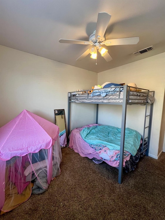 bedroom featuring ceiling fan and carpet