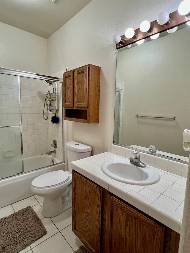 full bathroom with vanity, tile patterned floors, enclosed tub / shower combo, and toilet