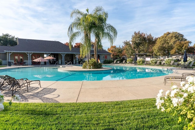 view of swimming pool with a patio area