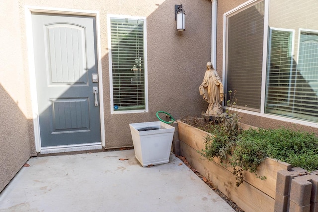 property entrance with a patio