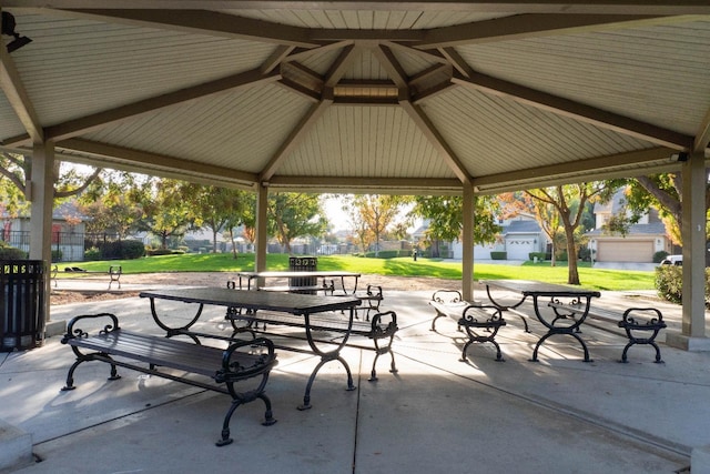 view of community featuring a gazebo, a patio area, and a lawn