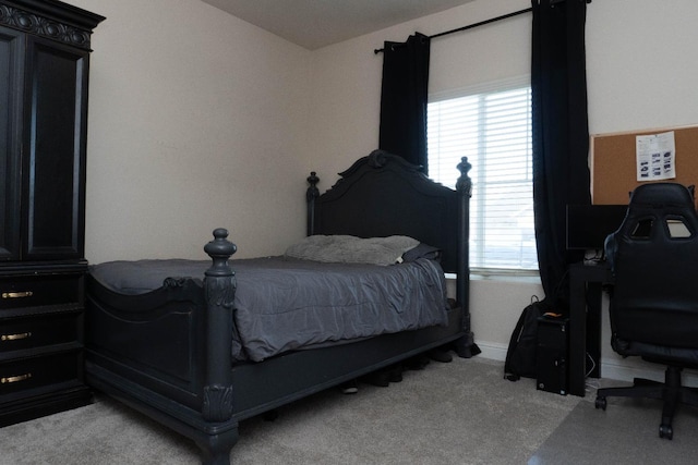 bedroom featuring light carpet