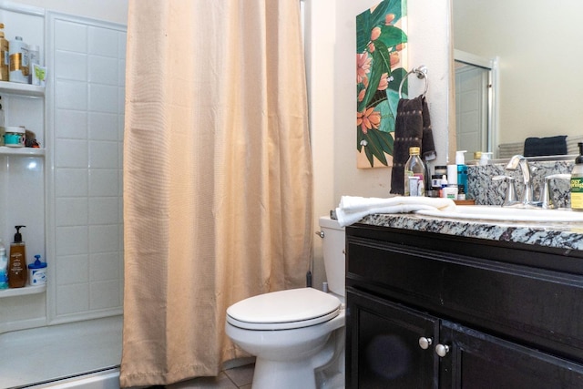 bathroom with tile patterned flooring, vanity, curtained shower, and toilet