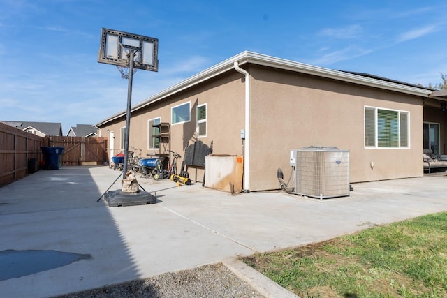 back of house featuring a patio and central air condition unit