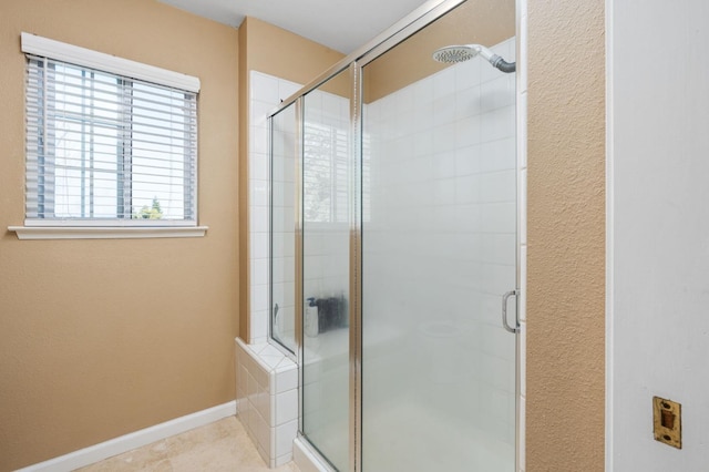 bathroom featuring an enclosed shower